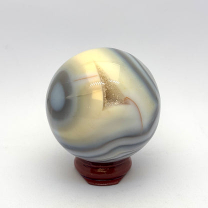 Kugle grå/blå agat 5,5 cm med lille grotte